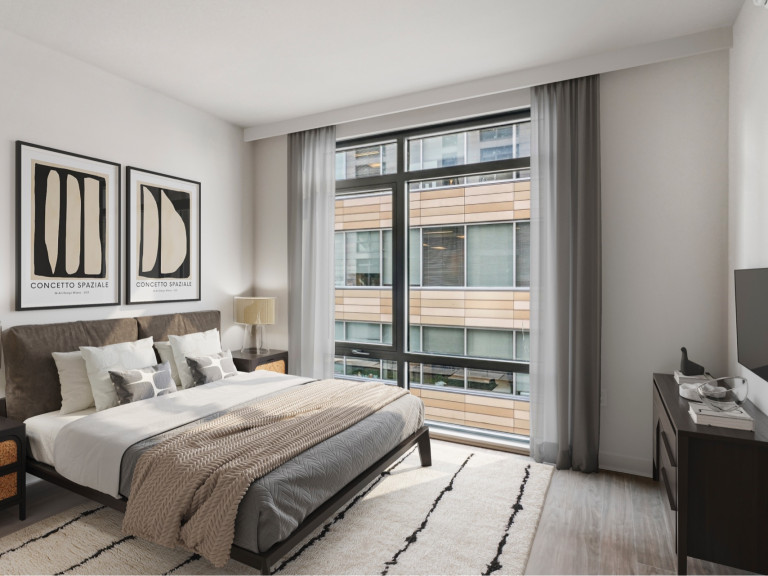 Wood-style, luxury flooring throughout bedroom and living spaces